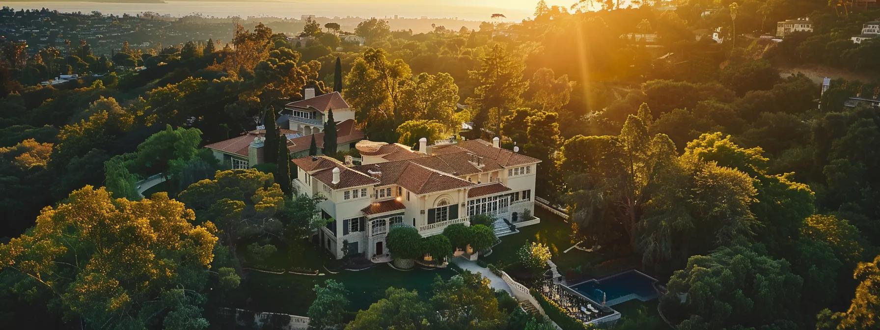 a breathtaking aerial view of a luxurious mansion nestled in lush greenery, showcasing grand architectural features and opulent details under the warm glow of a sunset sky.