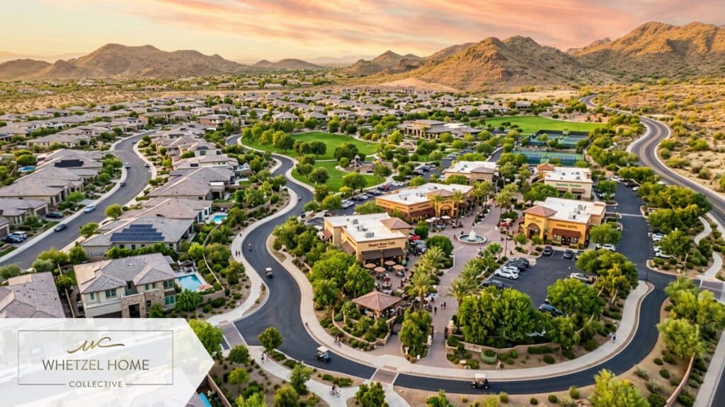 An aerial, drone-perspective photograph of a beautiful master-planned community seamlessly integrated with a localized commercial shopping zone. Winding paved walking trails and golf cart paths connect modern suburban homes to small retail shops and cafes. Lush green parks contrast with the surrounding desert landscape. Golden hour lighting, photorealistic style, vivid colors.