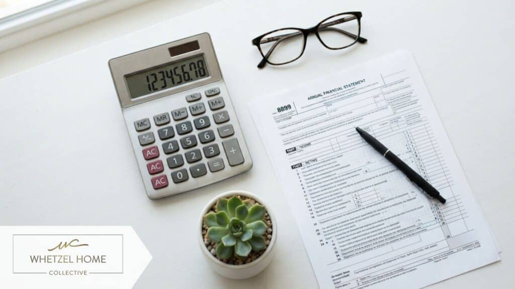 A highly detailed, photorealistic flat lay of a silver calculator resting next to a generic tax form, surrounded by a pair of sophisticated reading glasses and a small succulent plant on a clean white desk. Bright, crisp lighting, high contrast, professional accounting and finance mood, no visible text or logos.