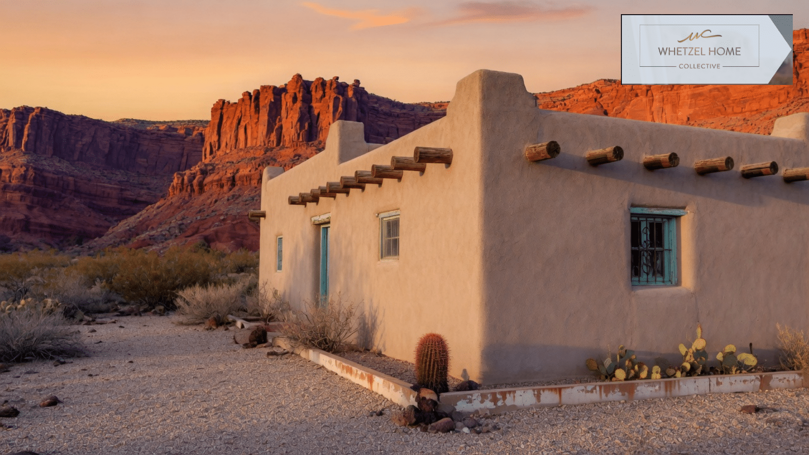 Stucco home in a desert yard with red rock cliffs near St. George